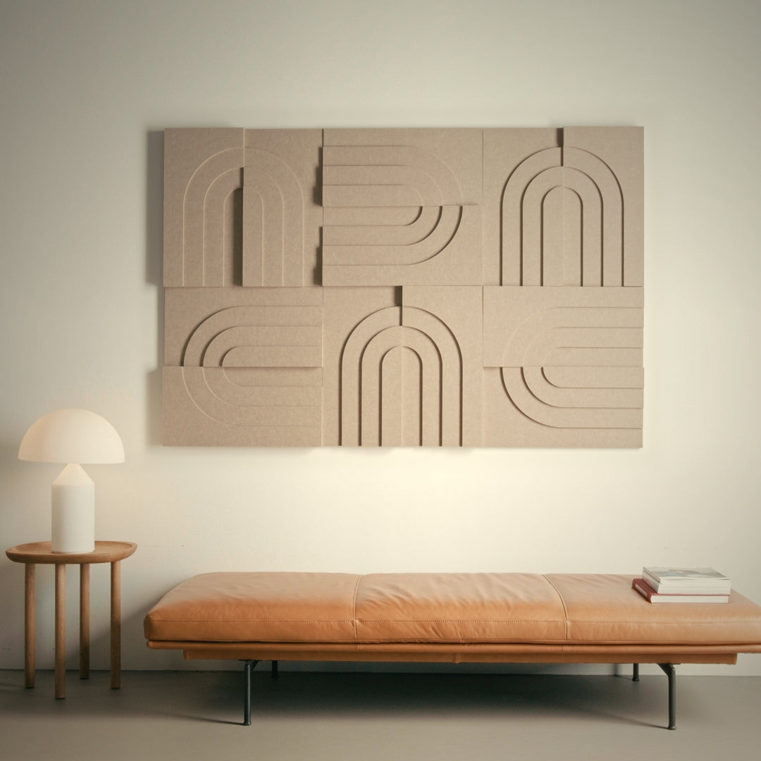 Arturel acoustic panels from the Arch series in a modern beige living room with a leather bench and wooden table in the foreground