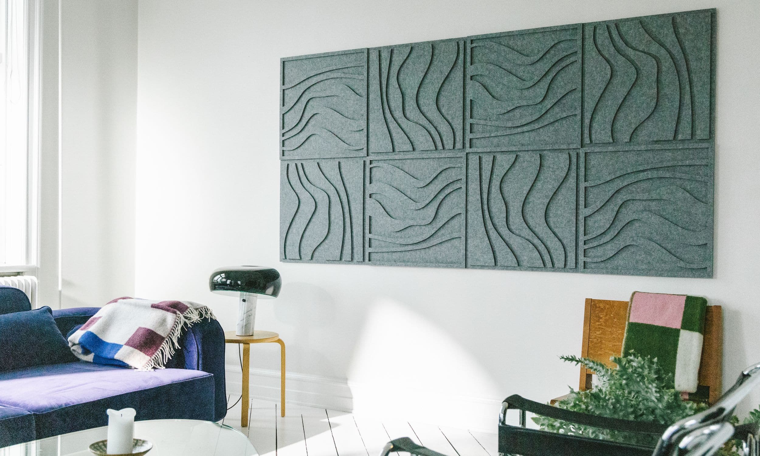 Arturel's grey Wave tile acoustic panels installed in a stylish living room